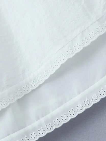 Hem detail of lace mini dress