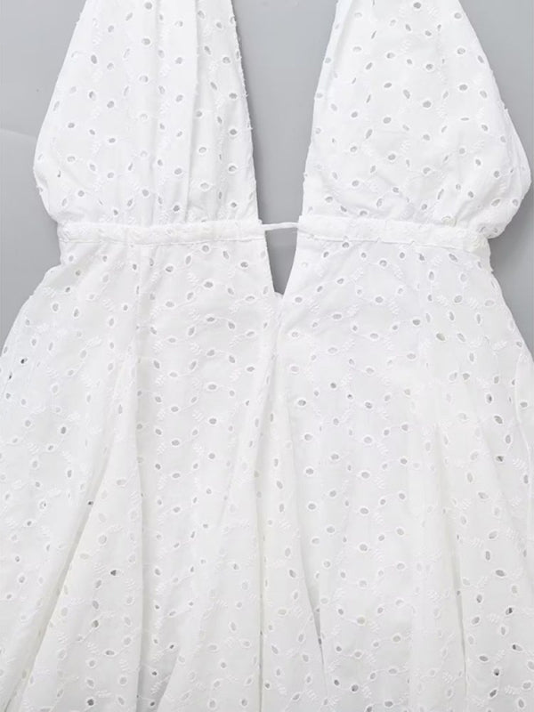 Detailed view of V-neck design on white dress