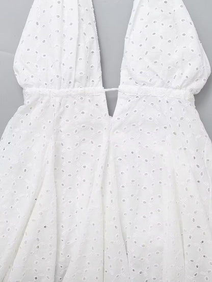 Detailed view of V-neck design on white dress