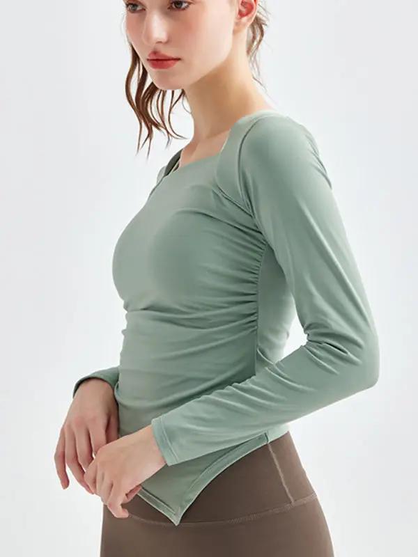 Green square collar yoga top, side view