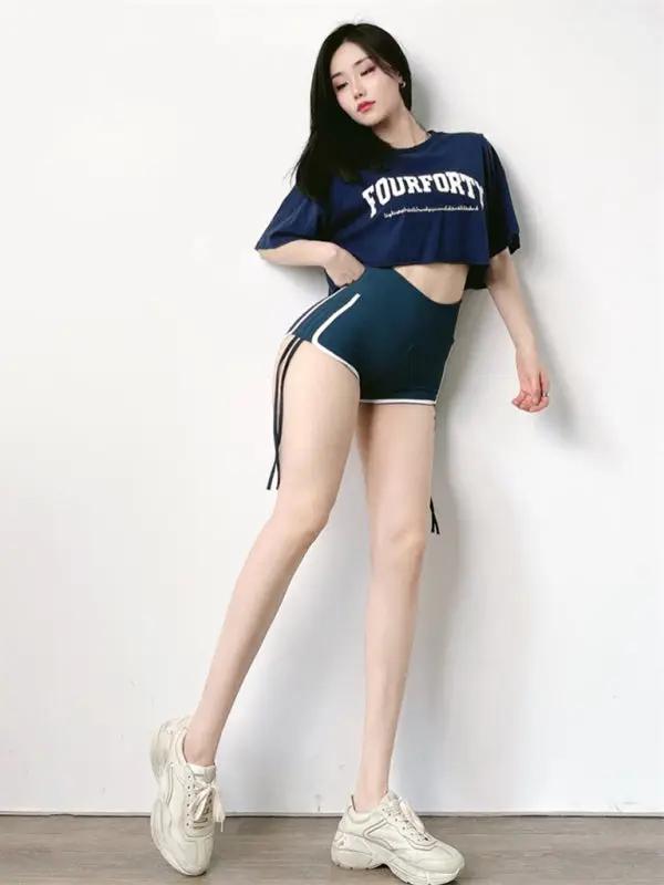 Navy lace-up hip-lifting shorts, full body view
