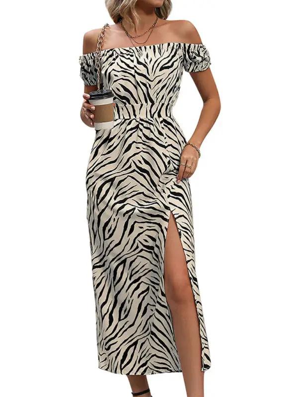 Zebra print boat neck dress with slit, holding coffee