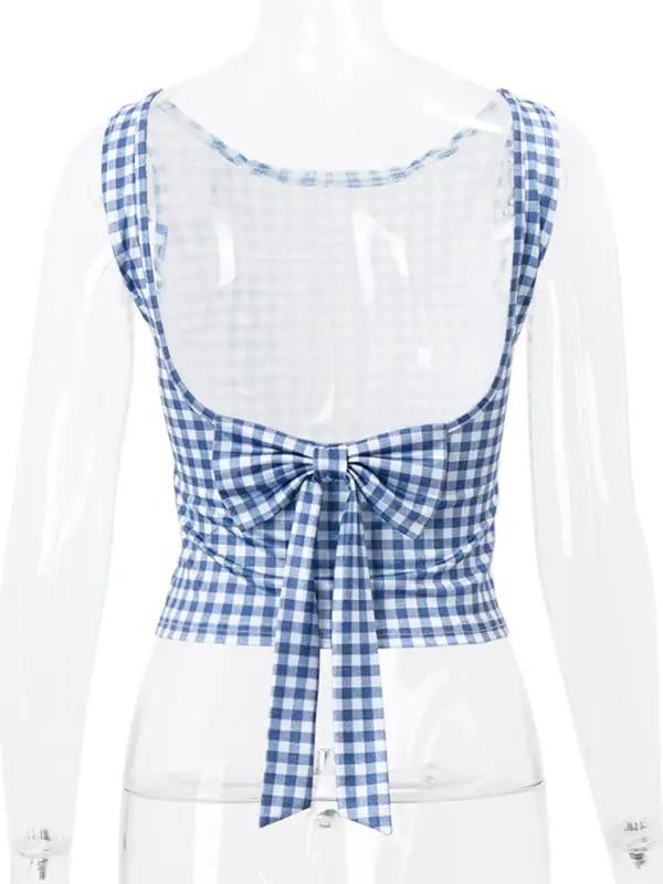 Back view of houndstooth vest featuring bow strap