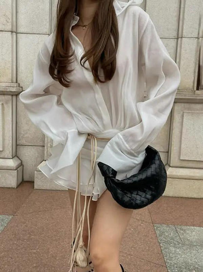 Casual white V-neck shirt dress with black handbag