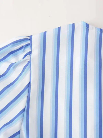 Close-up of blue striped puff sleeve detail