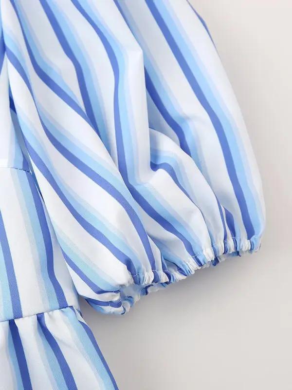 Close-up of blue striped puff sleeve