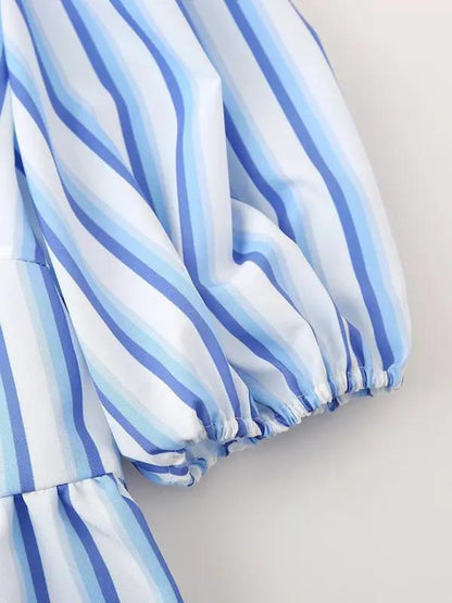 Close-up of blue striped puff sleeve