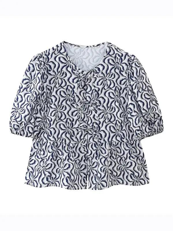 Navy patterned puff sleeve lace-up top, front view