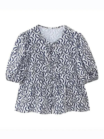 Navy patterned puff sleeve lace-up top, front view