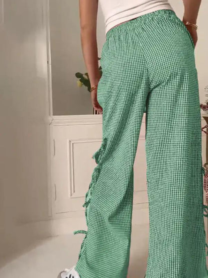 Back view of green plaid strappy trousers