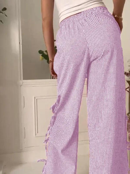 Back view of purple plaid strappy trousers