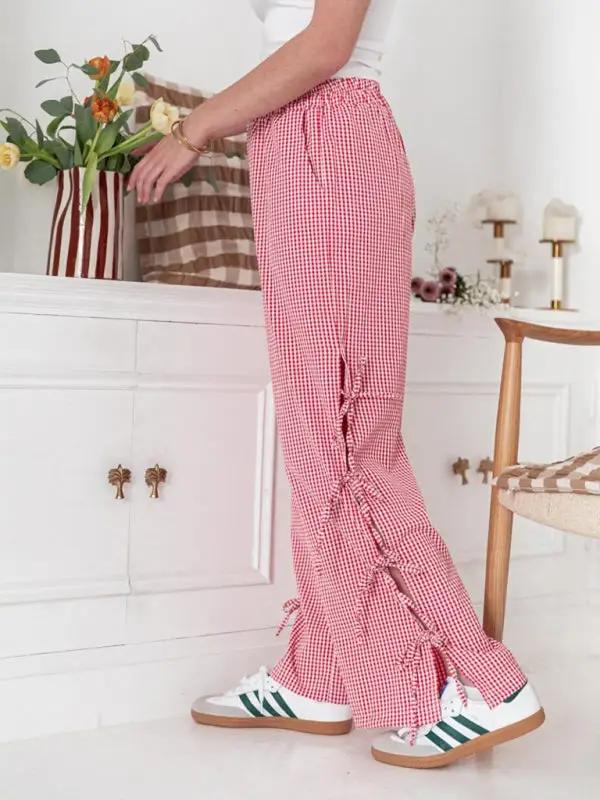 Side view of red plaid strappy trousers