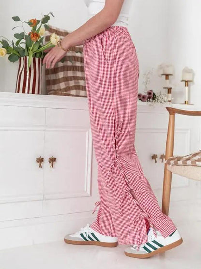 Side view of red plaid strappy trousers