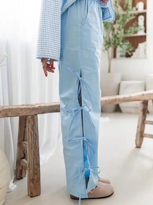 Side view of blue strappy trousers