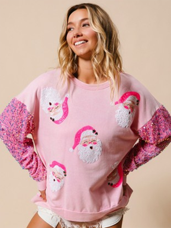 Pink sweater with Santa faces and sequin sleeves
