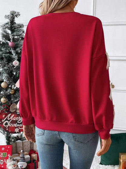 Back view of red Christmas sweater with bows