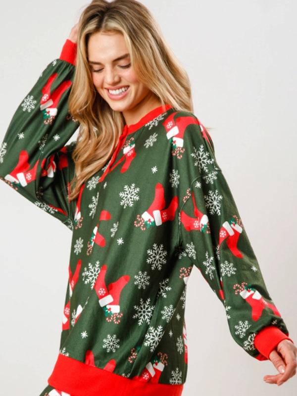 Green Christmas top with stockings and snowflakes design