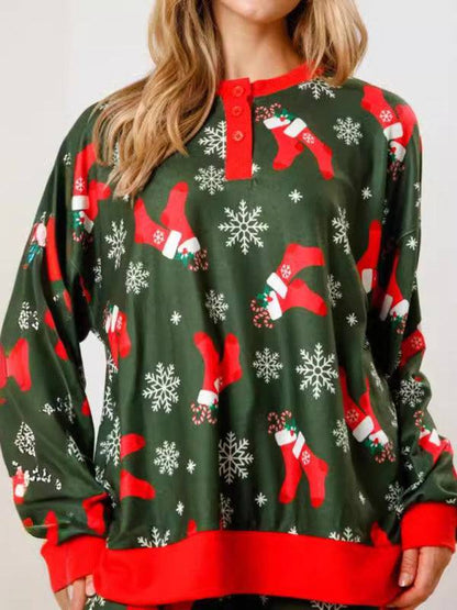 Green Christmas top with stockings and snowflakes pattern