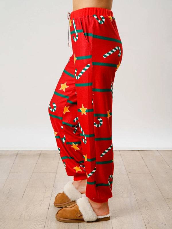 Side view of red Christmas pants with stars and candy canes