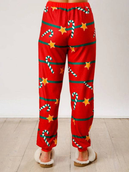 Back view of red Christmas pants with stars and candy canes