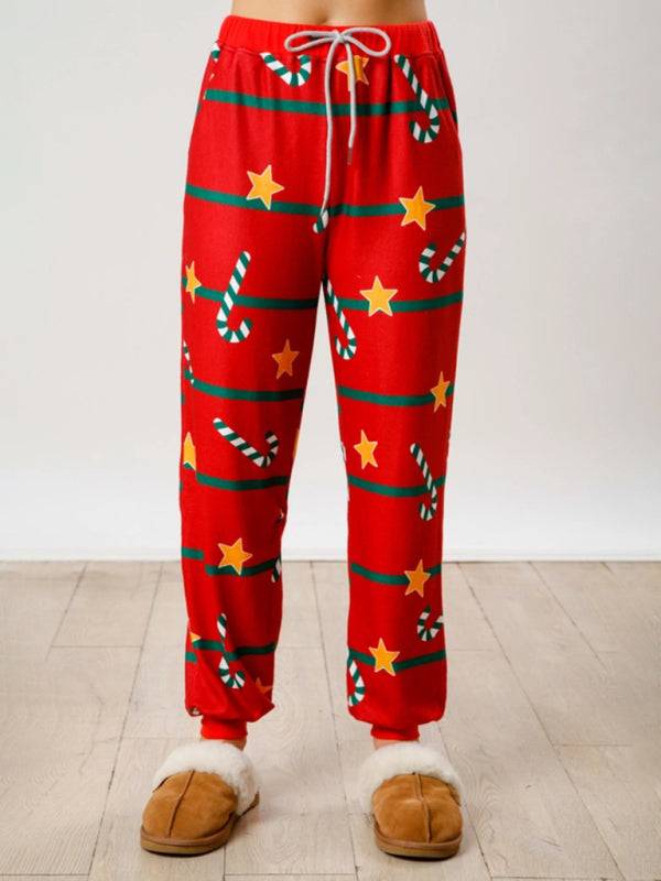 Front view of red Christmas pants with stars and candy canes