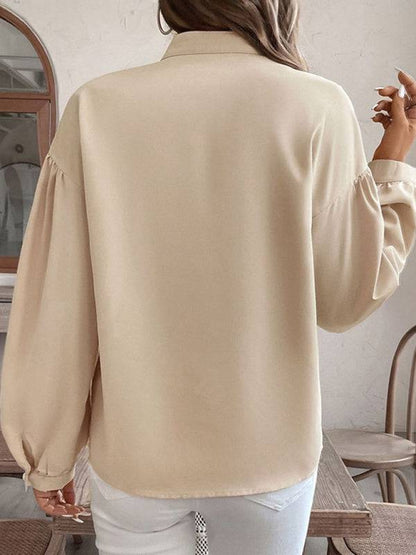 Back view of beige long-sleeved ethnic style shirt