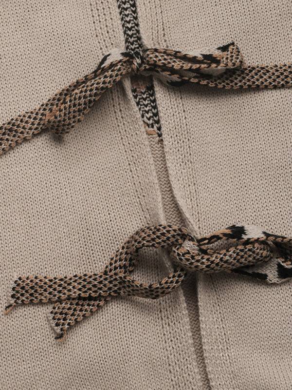 Close-up of leopard print stitching on cardigan