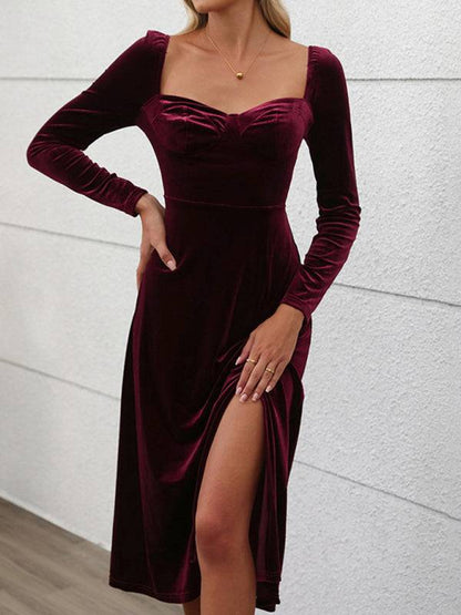 Burgundy velvet maxi dress with slit, long sleeves, and square neckline