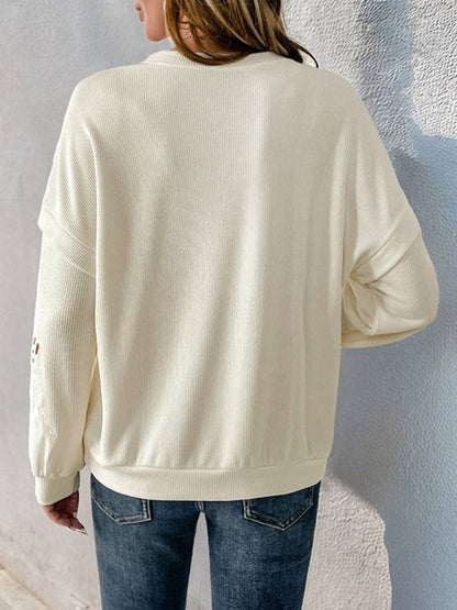 Back view of white textured pullover sweater