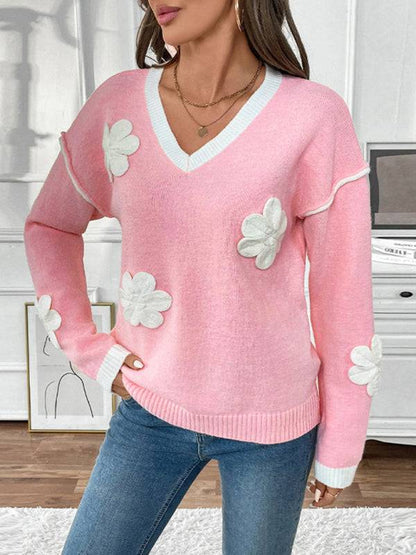 V-neck pink sweater featuring 3D floral appliques