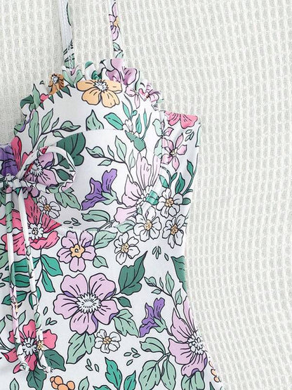 Close-up of green floral print swimsuit top