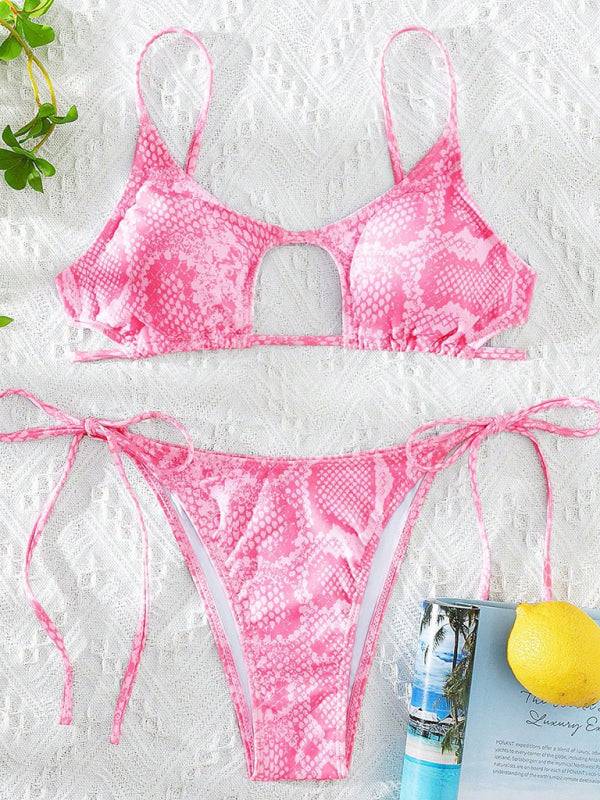 Bright pink snakeskin bikini set on lace fabric