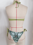 Back view of two-tone printed bikini on mannequin