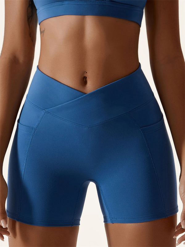 Leggings de sport à taille croisée avec poches sur les hanches nues pour femmes 