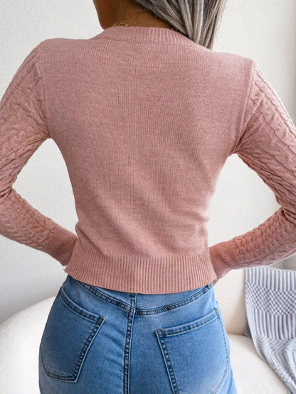 Pull torsadé à manches longues et col rond pour femme 