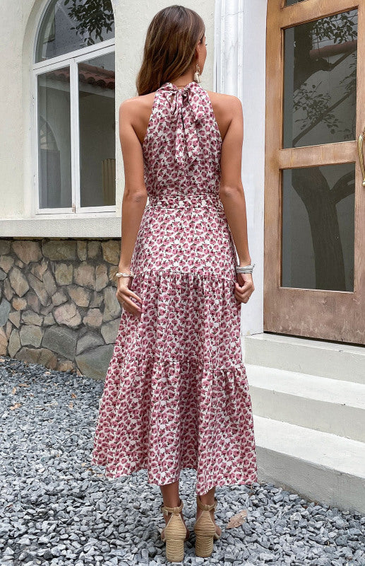 a woman standing in front of a house