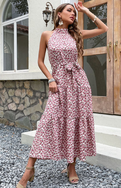 a woman in a red and white floral print dress