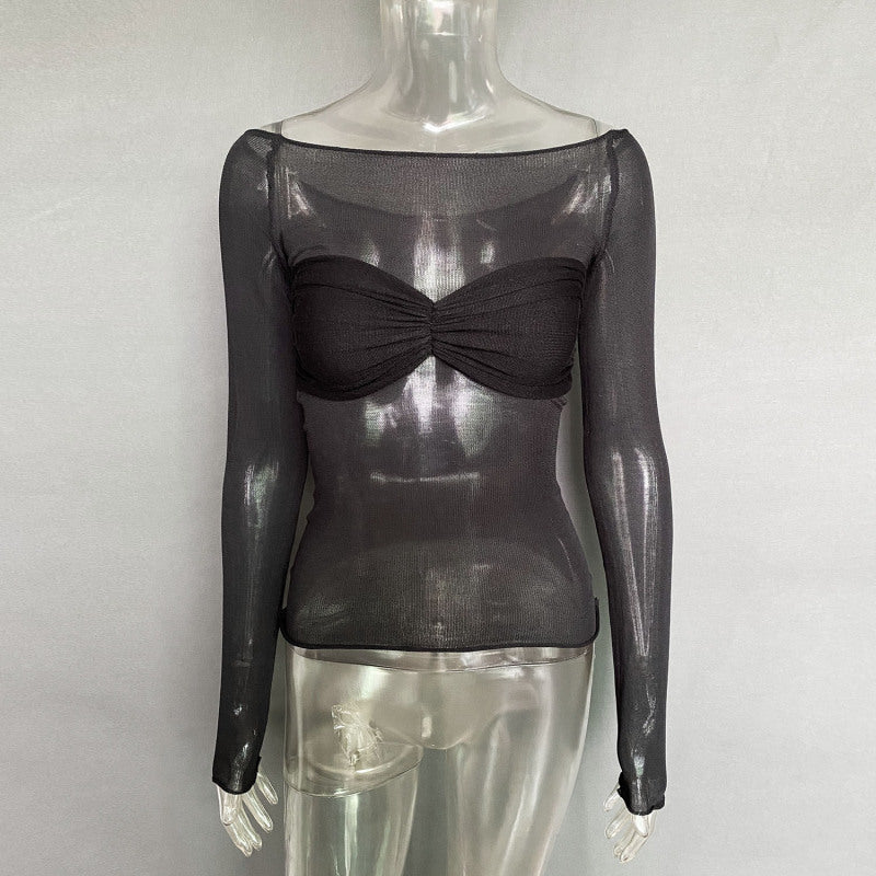 a mannequin wearing a black top with a bow