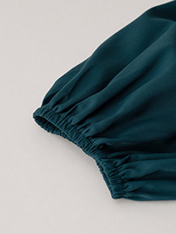 a close up of a teal colored cloth