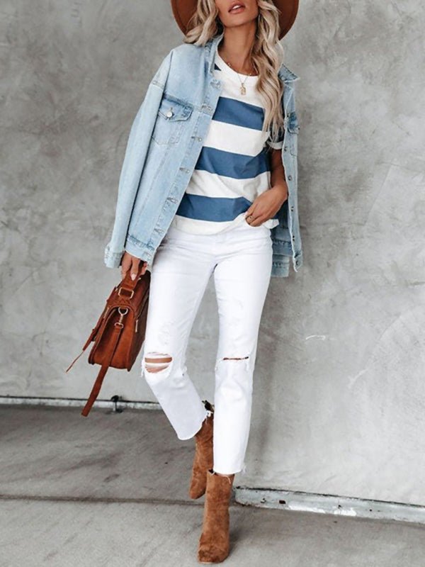 a woman wearing white jeans and a denim jacket