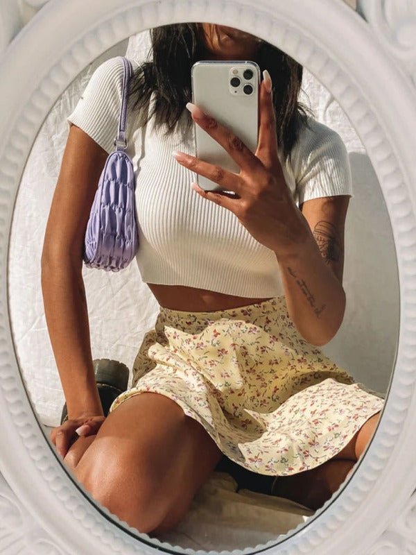 a woman taking a selfie in a mirror