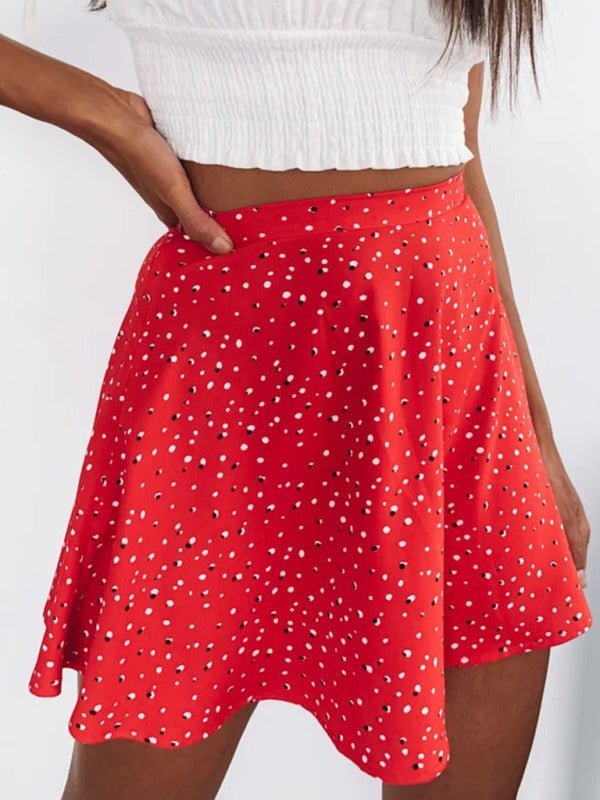 a woman wearing a red polka dot skirt