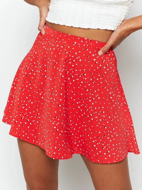 a woman wearing a red polka dot skirt