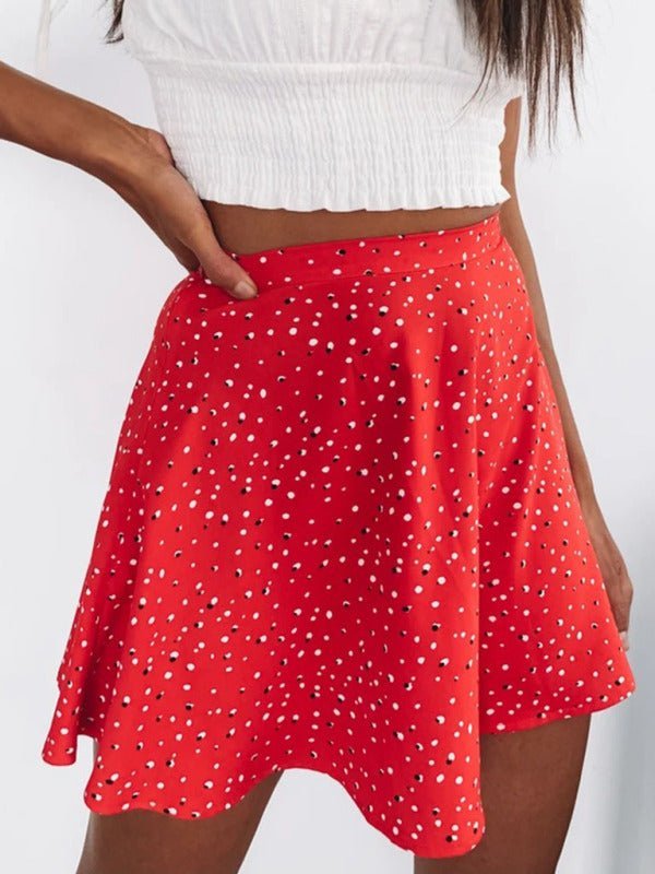 a woman wearing a red polka dot skirt