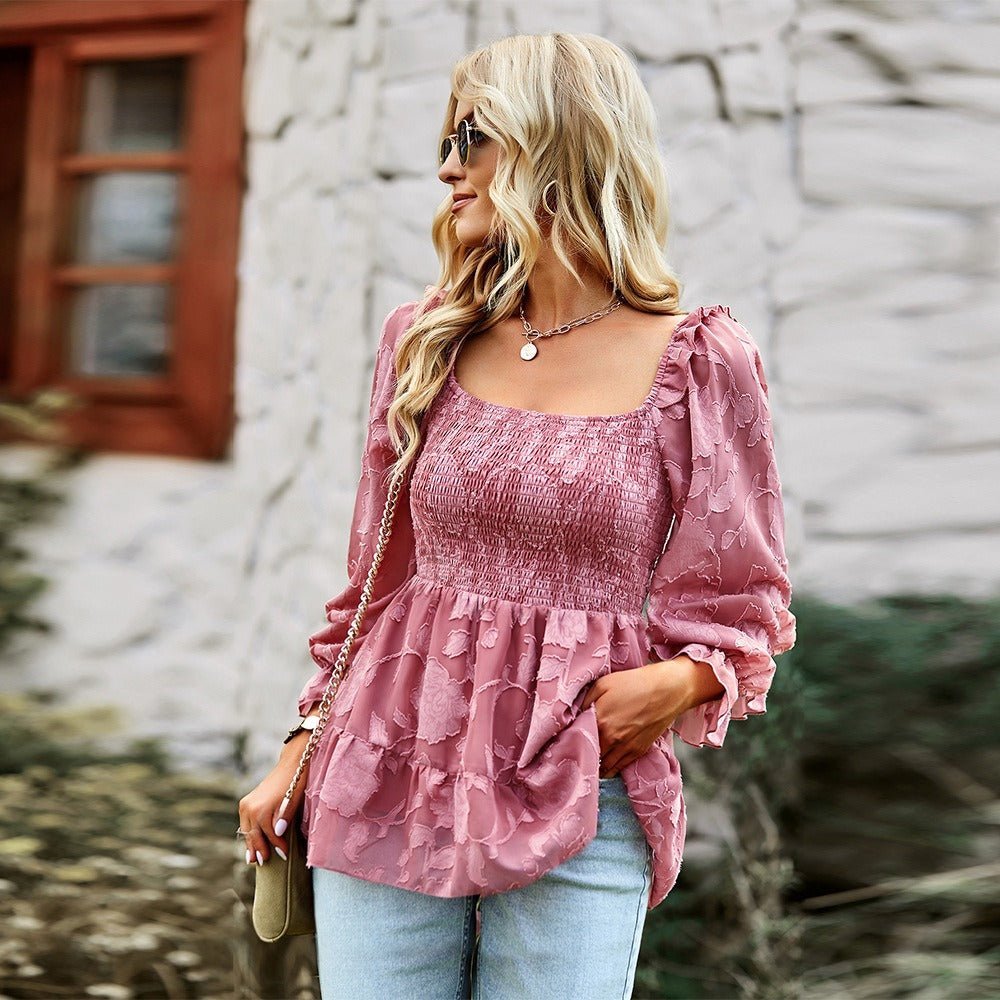 a woman wearing a pink blouse and jeans