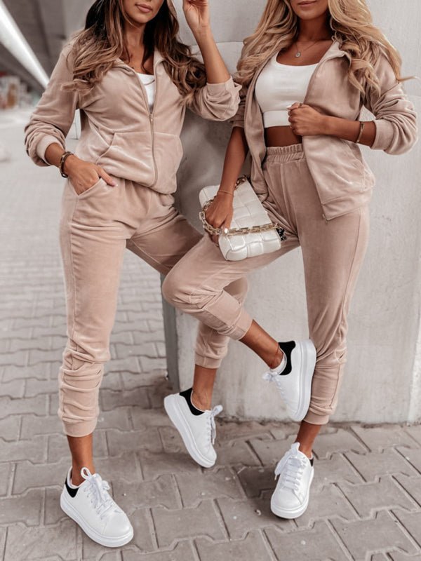 two women standing next to each other wearing matching outfits