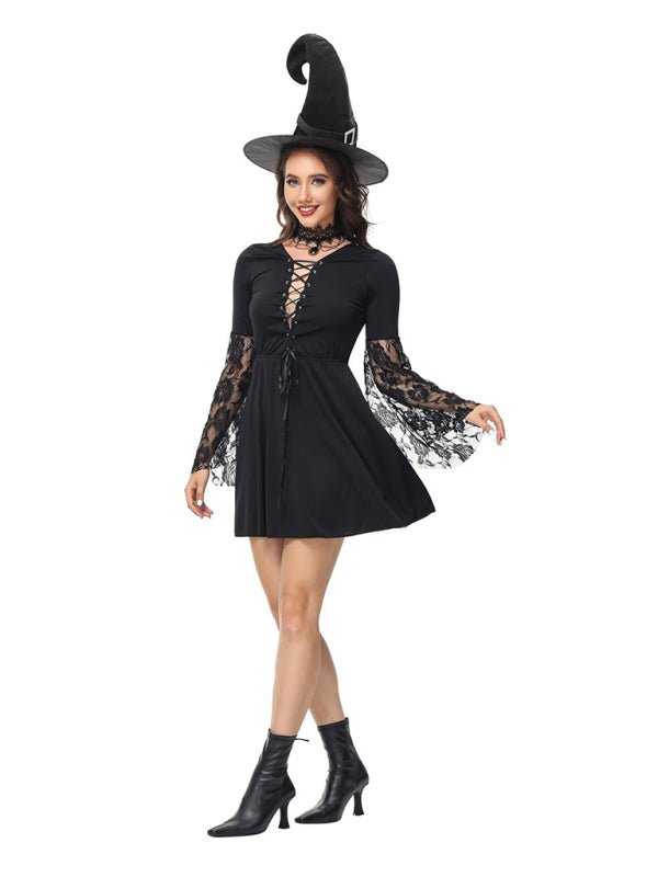 a woman wearing a black dress and a witches hat