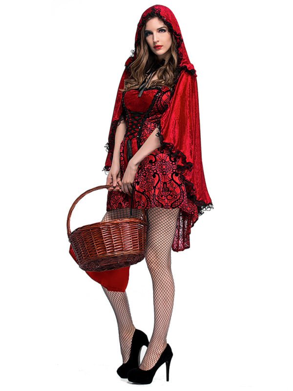 a woman in a red dress and a red cape holding a basket