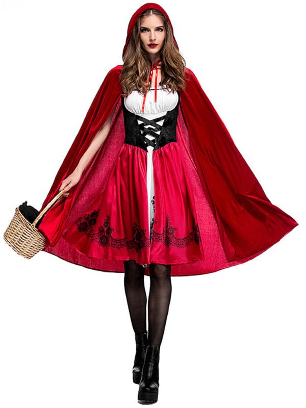 a woman dressed in a costume with a red cape