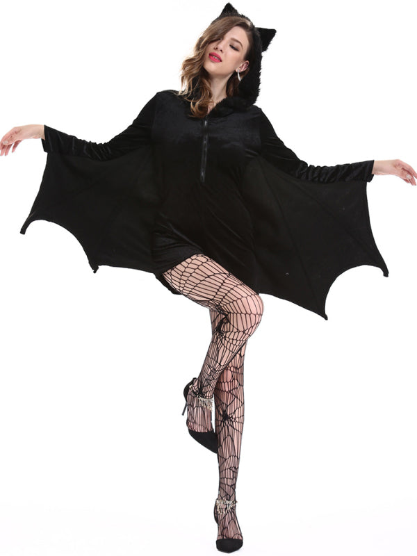 a woman wearing a black bat costume